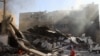 TOPSHOT - A Palestinian boy sits on the rubble of the destroyed Maghazi Camp Services Club building following an Israeli strike on the Maghazi refugee camp in the Gaza Strip on October 24, 2024, amid the ongoing war between Israel and Hamas.